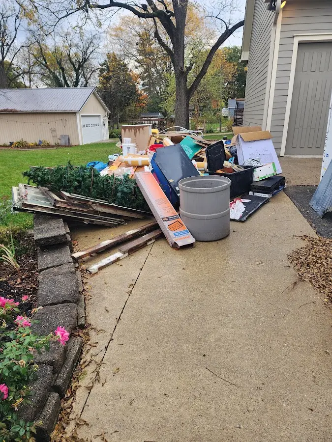 Dumpster being loaded with debris for 12 Yard Dumpster Rental in Cape Coral